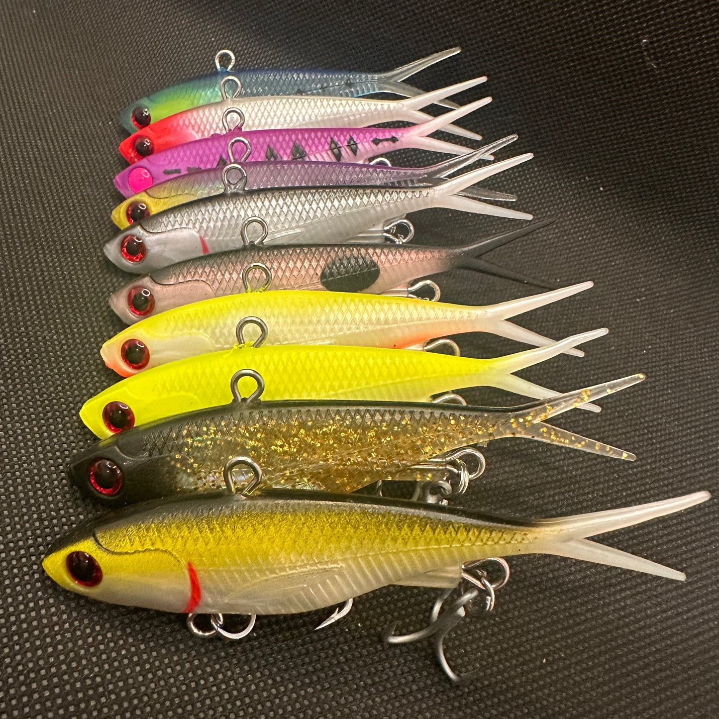 Assorted 95mm 20g Weapon Box lipless vibe lures packed in reusable lure tray, perfect for tight water and spooky fish – Reel Action Lures