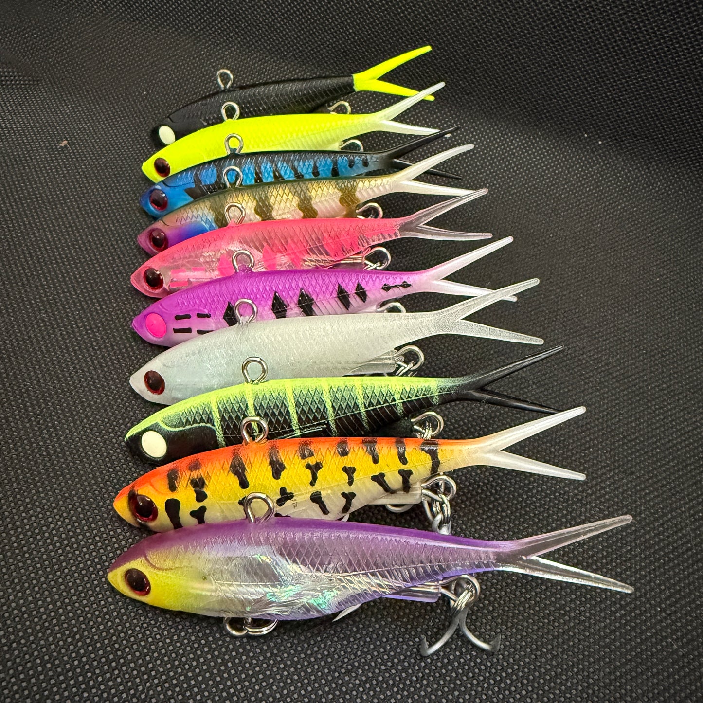 Bulk pack of 95mm 20g lipless vibe fishing lures in assorted colours, ideal for barra, threadies, salmon, flatties and reefies – Reel Action Lures Weapon Box