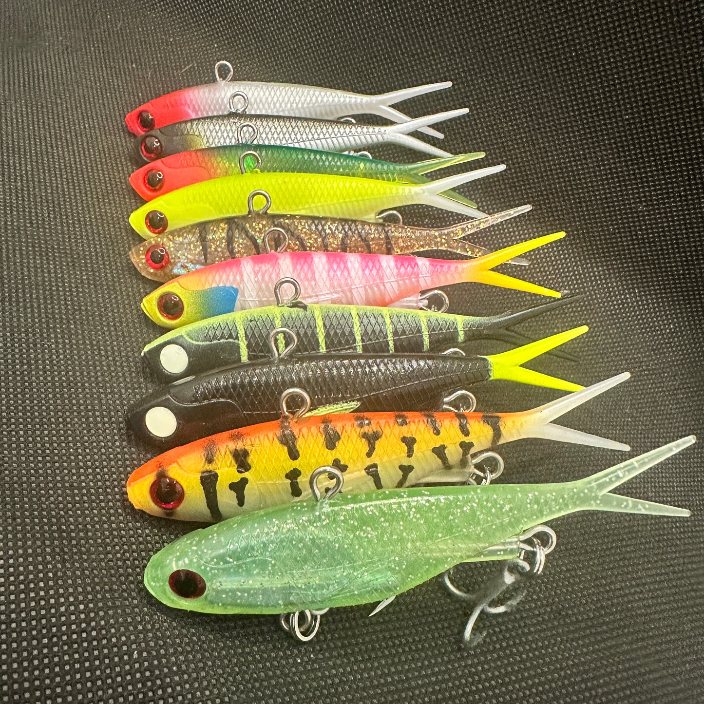 Assorted 95mm 20g Weapon Box lipless vibe lures packed in reusable lure tray, perfect for tight water and spooky fish – Reel Action Lures