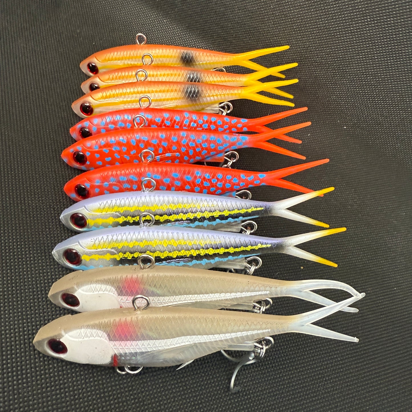 Fresh Hit Box 2.0 pack of mixed colour vibe lures including Stripey, Trout, Whitebait and Volt Runner, rigged with HD trebles.