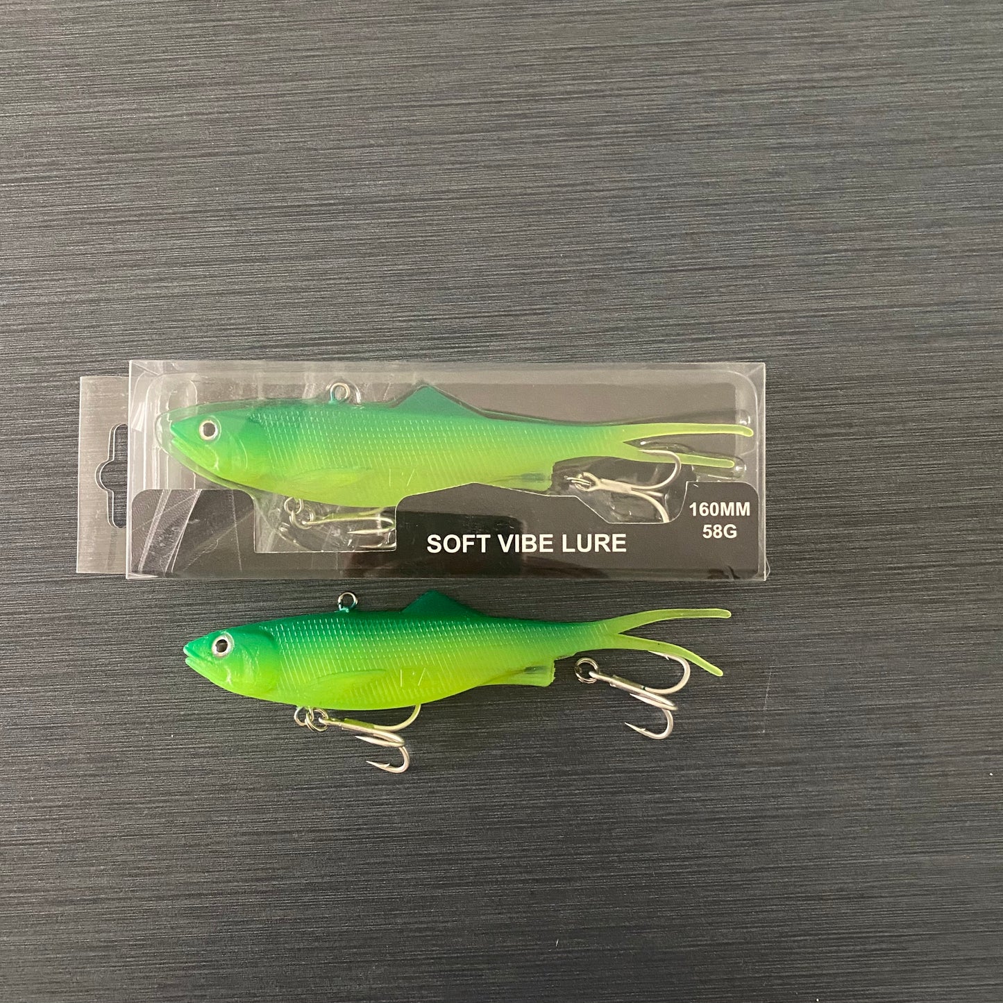 Side profile of packaged 160mm Green Reel Action Vibe fishing lure, ready for reef and offshore fishing.